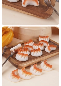 Detailed close-up of lifelike PVC shrimp dumpling models with realistic texture and colors