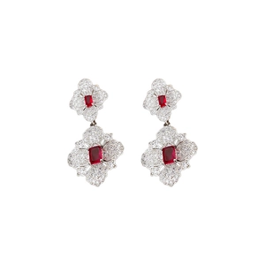 Silver flower earrings featuring square red gems and zircon stones on a white background