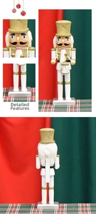 Detail of 26cm white and gold nutcracker soldier with drum and festive glitter accents