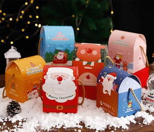 Close-up of colorful Christmas gift boxes with deer and snowman cartoon patterns