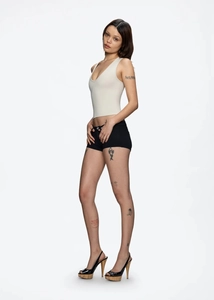Close-up of black low-waist slim fit mini shorts with professional fabric texture details