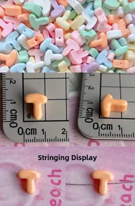 Detail view of 10mm macaron resin alphabet beads with side holes for DIY crafts