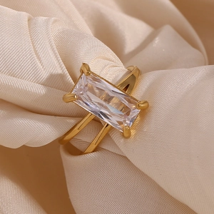 Macro detail of 18K gold plated double layer ring with rectangular zircon on champagne silk