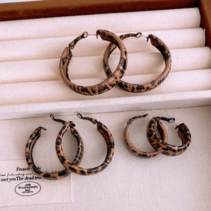 Three sizes of vintage leopard print hoop earrings in tortoiseshell pattern