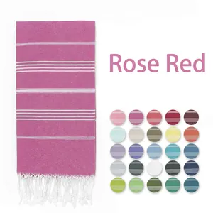 Detailed view of rose red Turkish towel with white stripes and fringe with color options