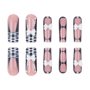 Pink press-on nails with black French tips, 3D white bows and sparkly glitter mesh patterns