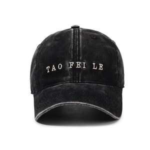 Vintage washed cotton baseball cap in black with letter embroidery and curved brim