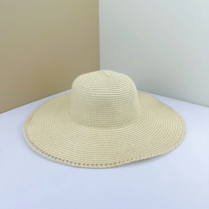 Foldable beige straw sun hat with wide brim and decorative lace edges for summer
