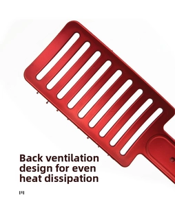 Detail view of the hollow back design on a red hairbrush for even heat dissipation