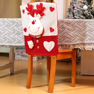Detail of 3D reindeer Christmas chair cover with heart patch and wooden button