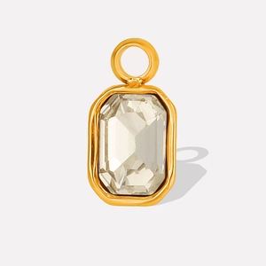 Detail of a rectangular faceted glass stone pendant set in a golden stainless steel frame
