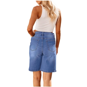 Detailed back view of vintage blue slim fit denim shorts on model with white vest