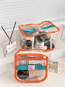 Transparent PVC makeup bag set with orange trim and blue strap for travel toiletries