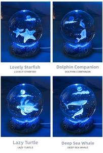 Detail of 3D laser engraved marine crystal balls with dolphin and turtle patterns