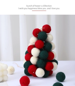 Detailed view of 3cm wool felt ball Christmas tree ornament in red, green and cream colors