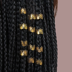 Golden crown hair cuffs for dreadlocks with hollowed-out metal design on black braids