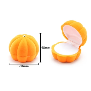 Detailed view of orange velvet pumpkin jewelry box with dimensions 60mm by 48mm