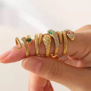 Vintage gold snake ring set in titanium steel with sparkling crystal and emerald stone eyes