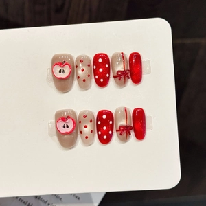 Handmade 3D red apple press-on nails with white polka dots and ribbon bows