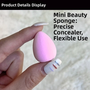 Close-up of a pink mini makeup sponge for precise concealer application on fingertips