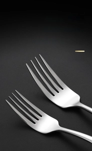 Detailed close-up of polished 304 stainless steel fork with smooth ground teeth and edges