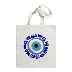 White canvas tote bag with Turkish Evil Eye symbol and No Bad Vibes slogan print