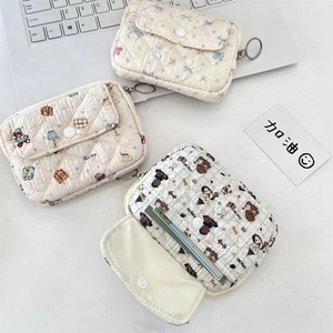 Close-up of quilted mini pouch set with bear and rabbit prints and metal zippers