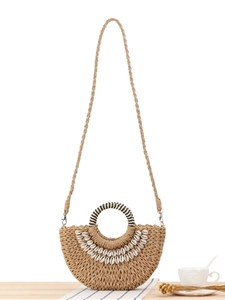 Minimalist straw woven semicircular handbag with natural shell accents for vacation