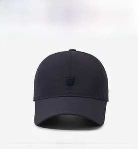 Close-up of shield logo on breathable quick-dry baseball cap with mesh texture