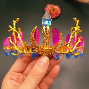 Detailed wire-wrapping of a golden crystal crown featuring moon and branch accents