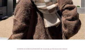 Close-up of thick knit coffee and beige checkered scarf with textured wool material