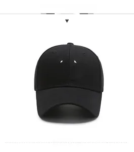 Detailed view of the white embroidered smiley face on a black cotton baseball cap