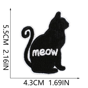 Detail view of black cat silhouette embroidery patch with meow text and size markings
