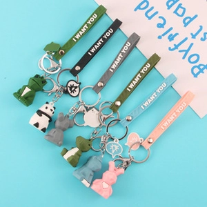 Close-up of cute 3D silicone animal keychains with colorful wristbands and metal rings
