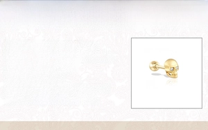 Macro view of 18K gold plated S925 silver skull stud earring with cubic zirconia eyes