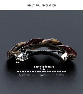 Detail showing 5.5cm tortoiseshell acetate hair clip with adjustable metal spring clasp