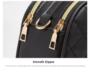 Detailed macro view of smooth dual metal zippers on a black quilted leather handbag