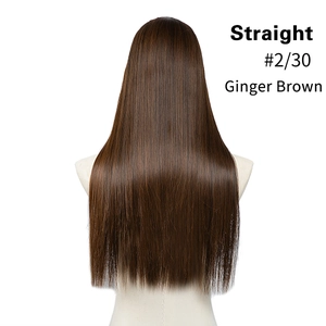 Detailed texture of ginger brown straight hair extensions on a mannequin stand