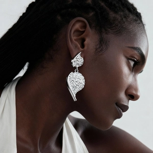 Metallic wrinkled heart stud earrings in silver finish featuring irregular texture design