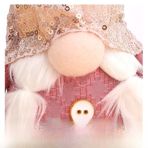 Detail of pink gnome with champagne sequined hat, white beard and a gold-rimmed button