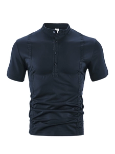 Detail of navy blue polo shirt featuring fine twill texture and decorative vertical seams