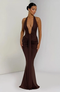 Detail of the mocha ruched halter neck evening dress with an elegant fishtail hemline