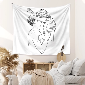Detail of a minimalist black line art tapestry featuring a couple hugging on a white fabric