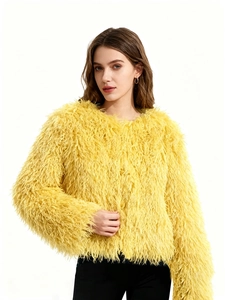 Macro detail of vibrant yellow faux fur texture on this stylish cropped women jacket