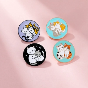 Set of four circular enamel cat brooches with colorful kitten hug designs in metal alloy