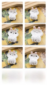 Detailed set of six pearlescent rabbit hair claws with cute facial expressions