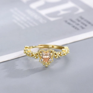 Exquisite gold heart-shaped citrine ring with halo diamonds and engraved open band