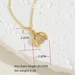 Detailed view of ladybug pendant with zircon stones showing dimensions 2.2 x 2.0 cm