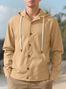 Detailed texture of men's linen hooded shirt with buttons and contrast drawstrings