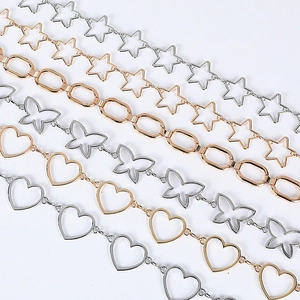 Detailed view of women's metal waist chains featuring heart, star, and butterfly shapes